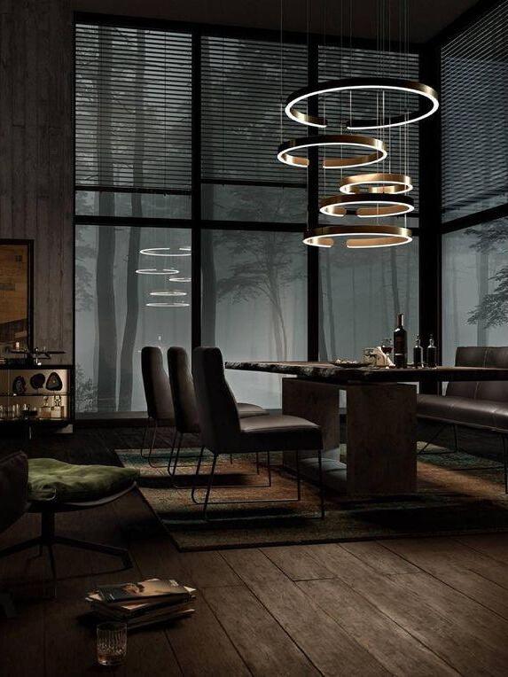 Stacked ring lighting in a tall room with windows