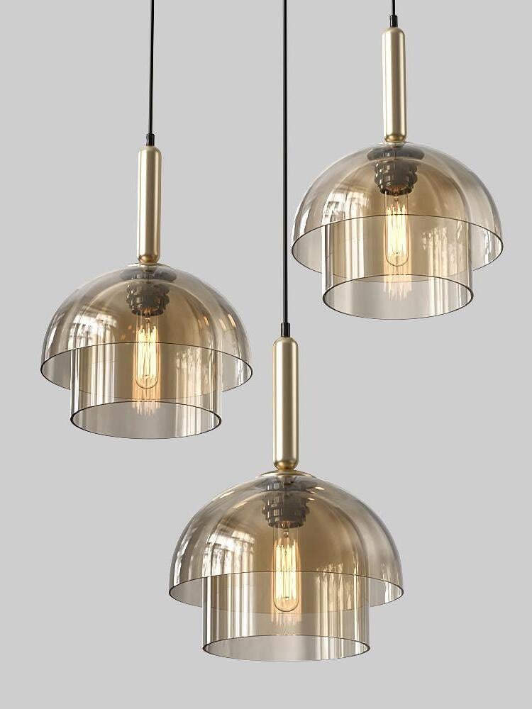 Three two-tier glass pendants at different heights, with domed tops, lower cylinders, gold-tone fittings and black cables