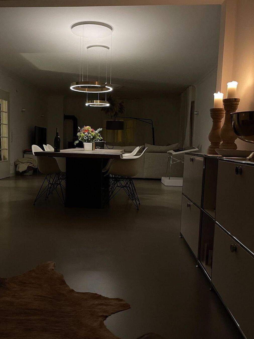Several ring lights in a dark dining room