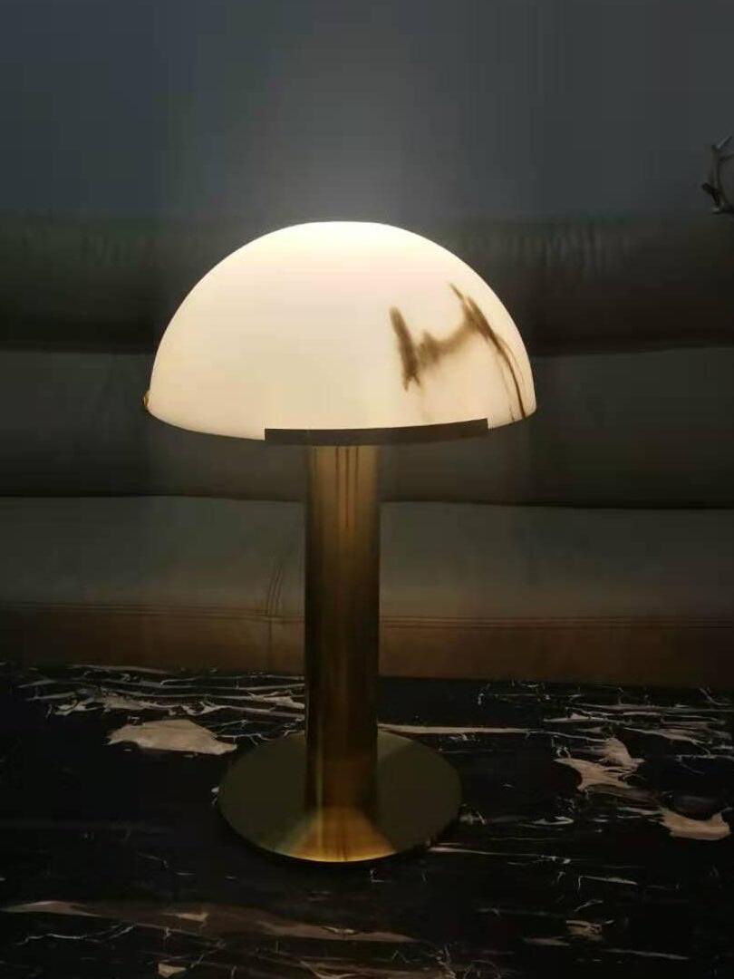 Illuminated veined dome lamp on a dark table