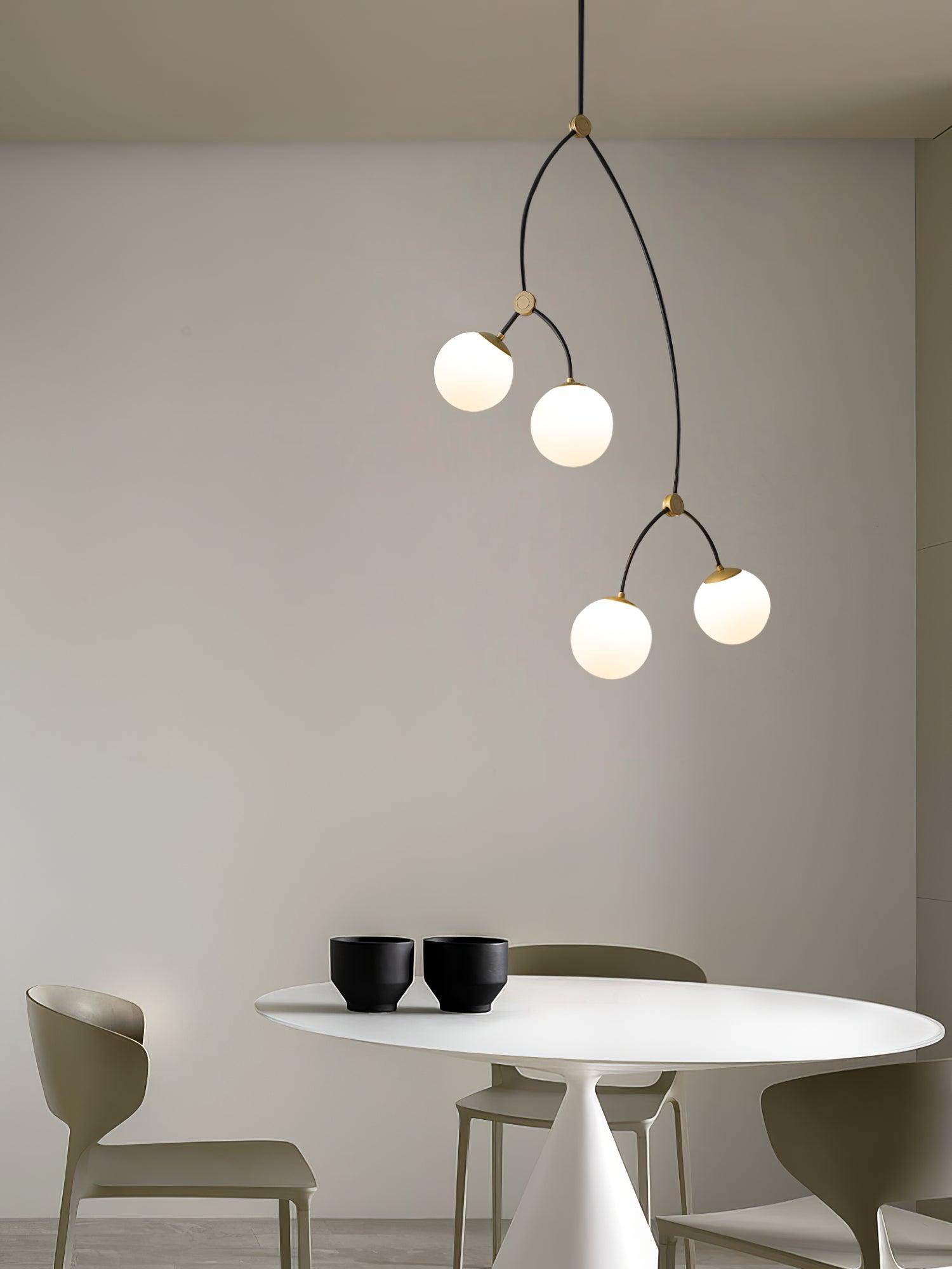 Four white glass globes above a small round table