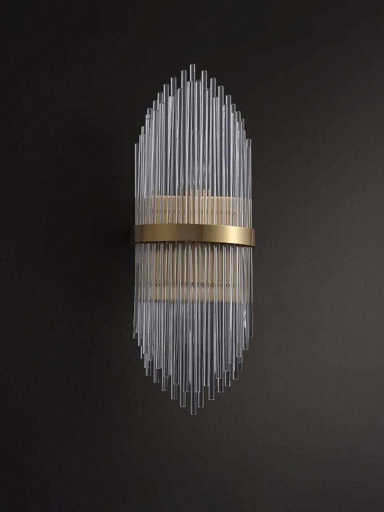 Dim view of vertical crystal rod sconce on charcoal wall