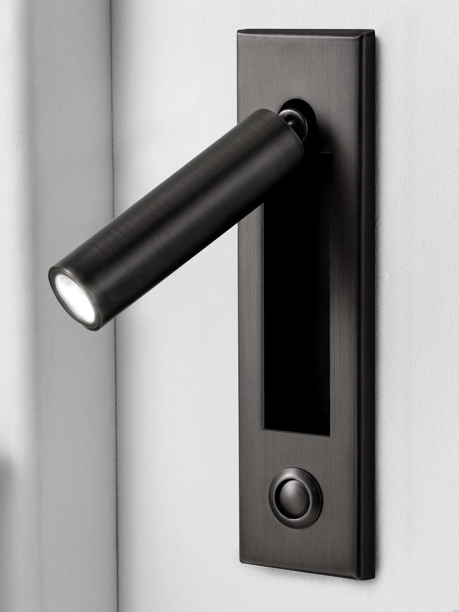 Matt black cylindrical reading head with a round button below the wall recess