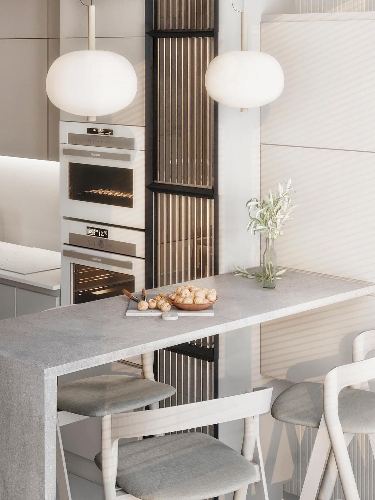 Two single-globe pendants over a kitchen island
