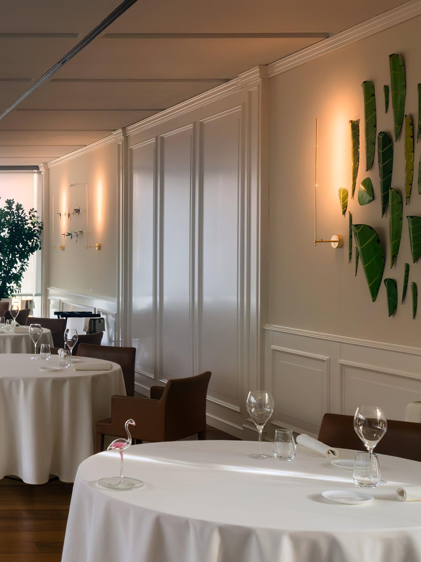 Vertical wall lights in a dining room