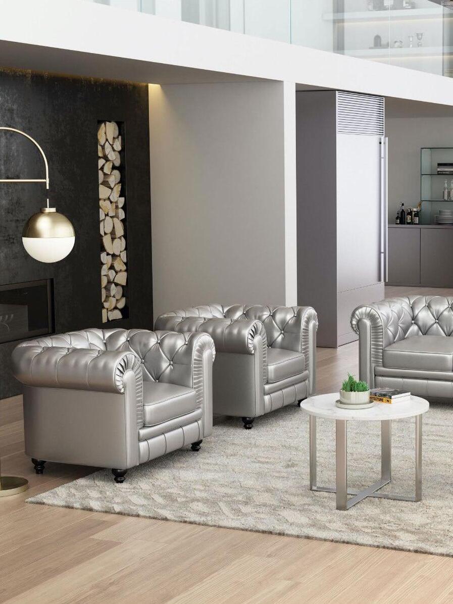 Waterloo Gold arc lamp beside a grey sofa