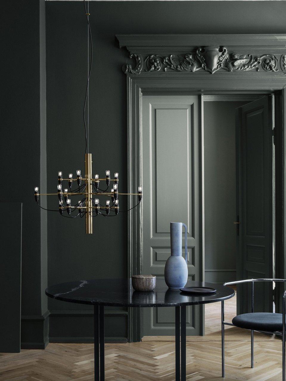 Small tiered chandelier in a dark interior