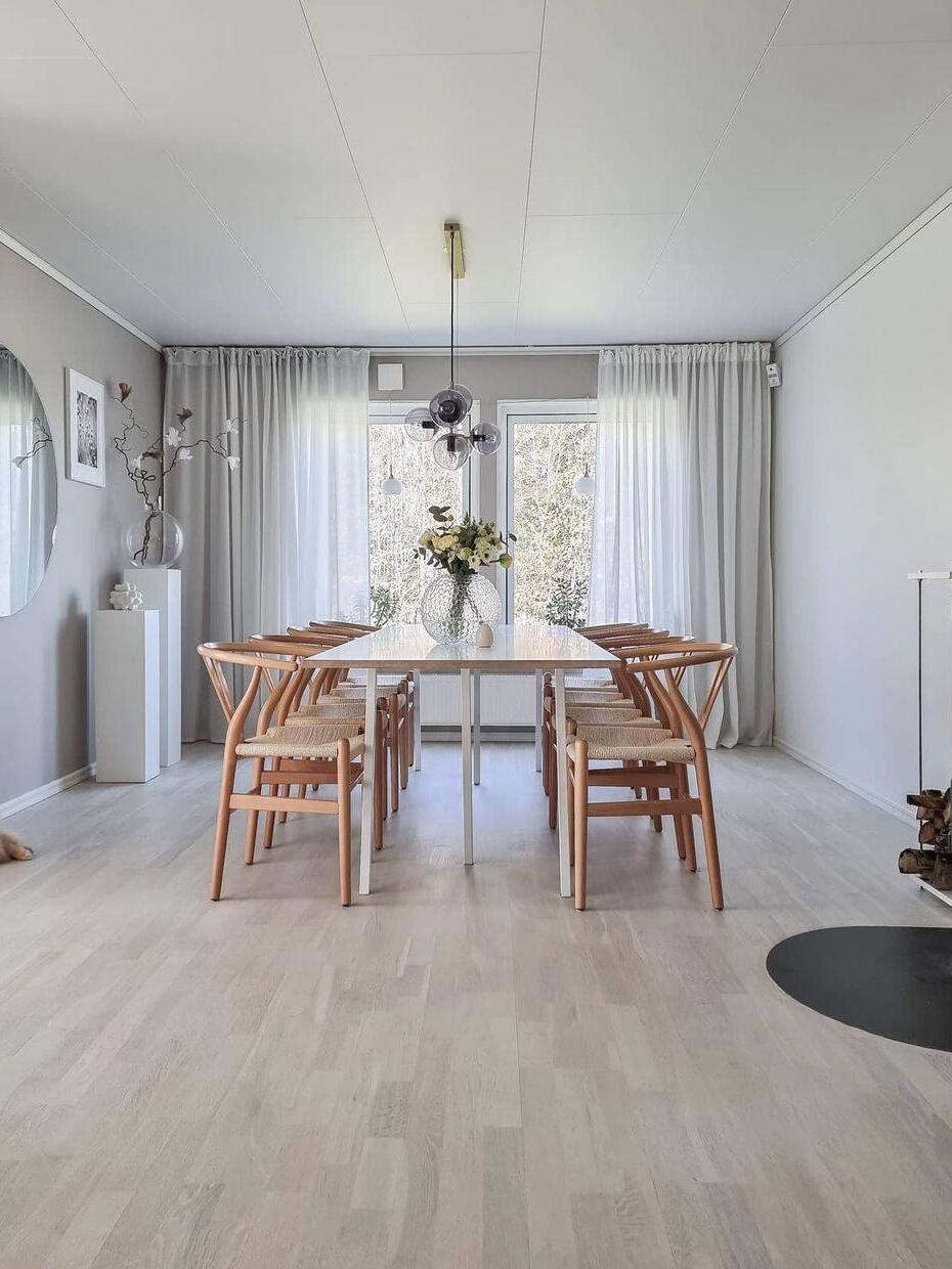 Globe chandelier above a table in a bright room