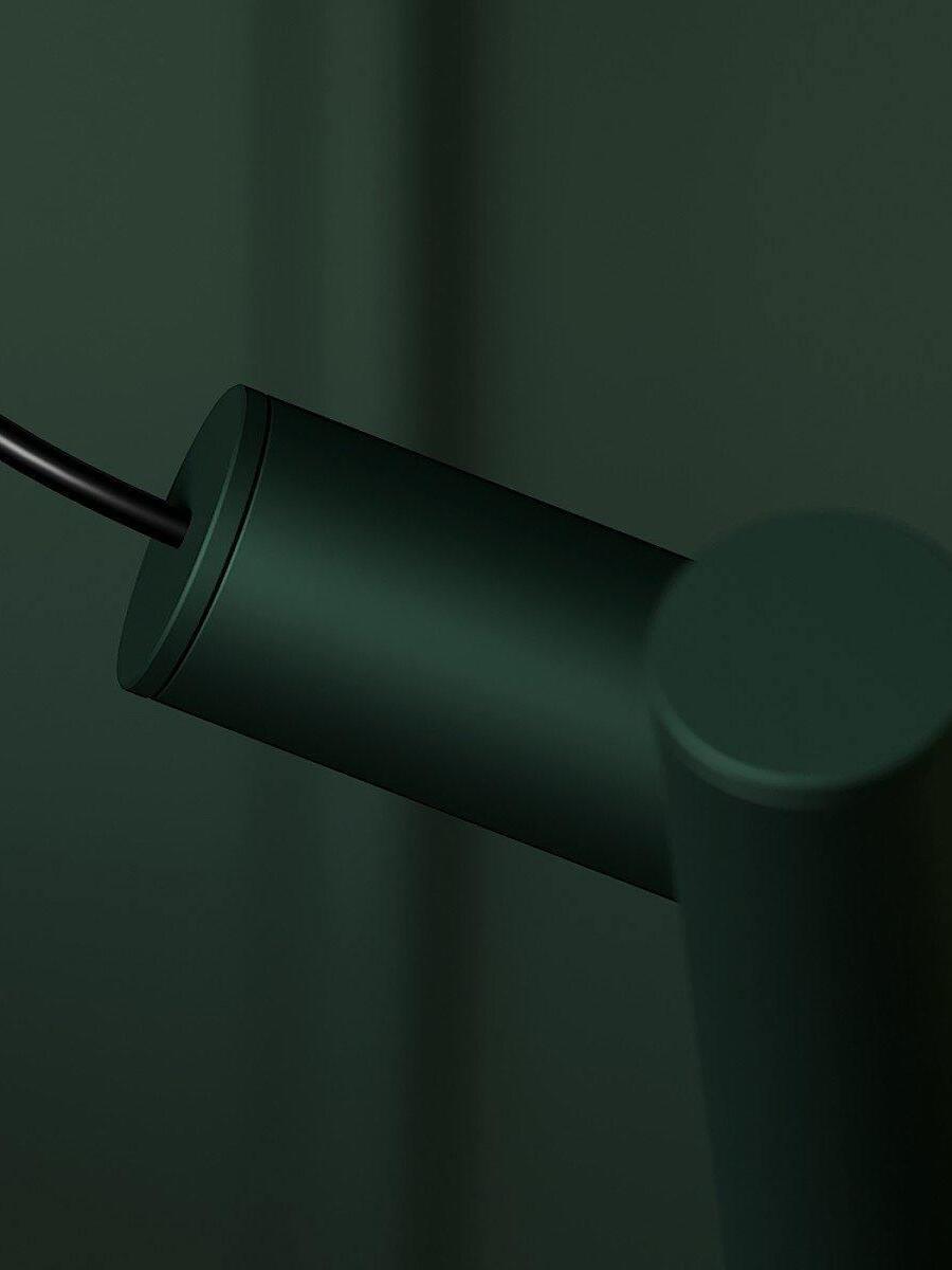 Close-up of a painted tube joint and cord entry