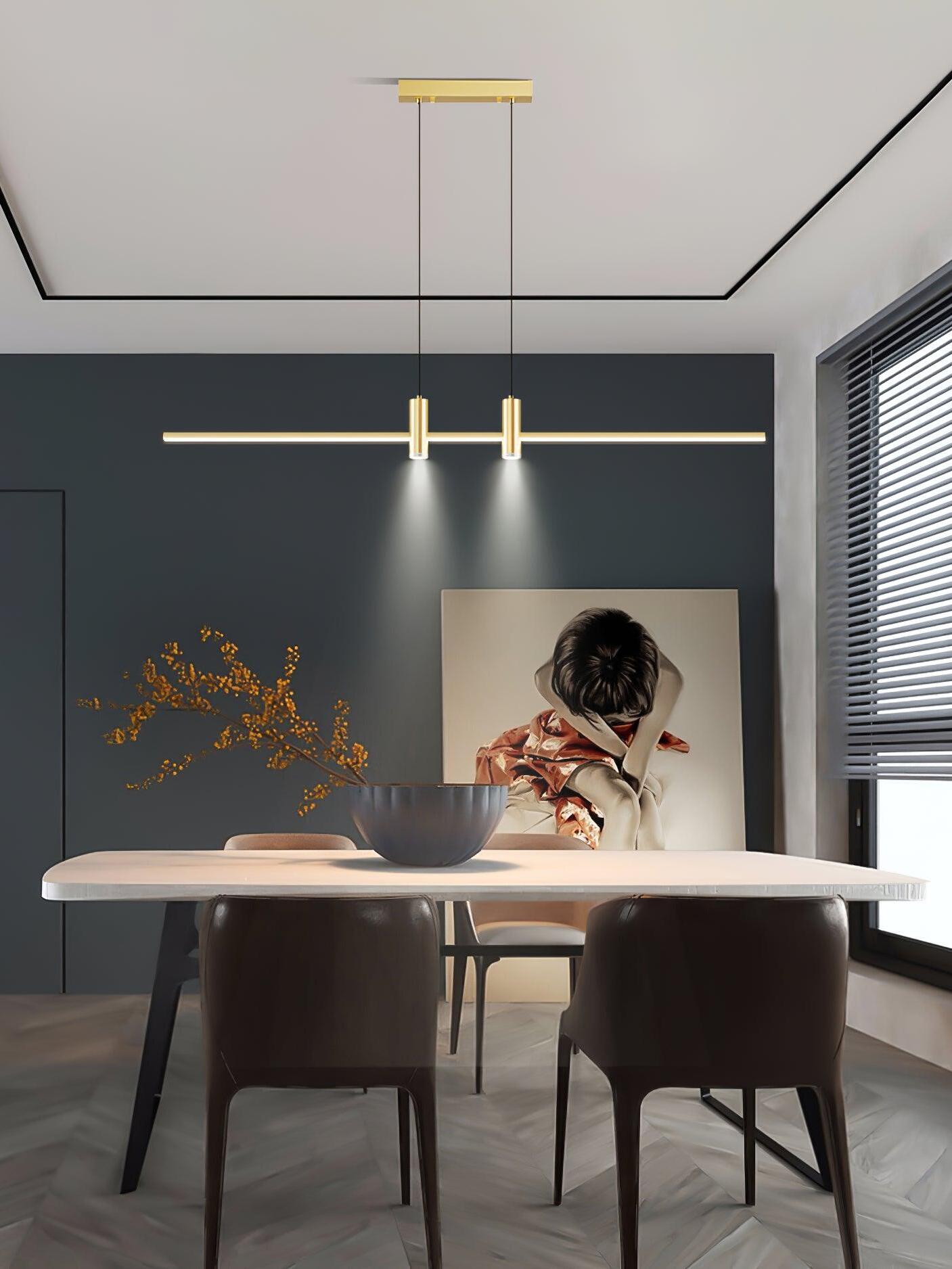 Gold linear pendant over an indoor table