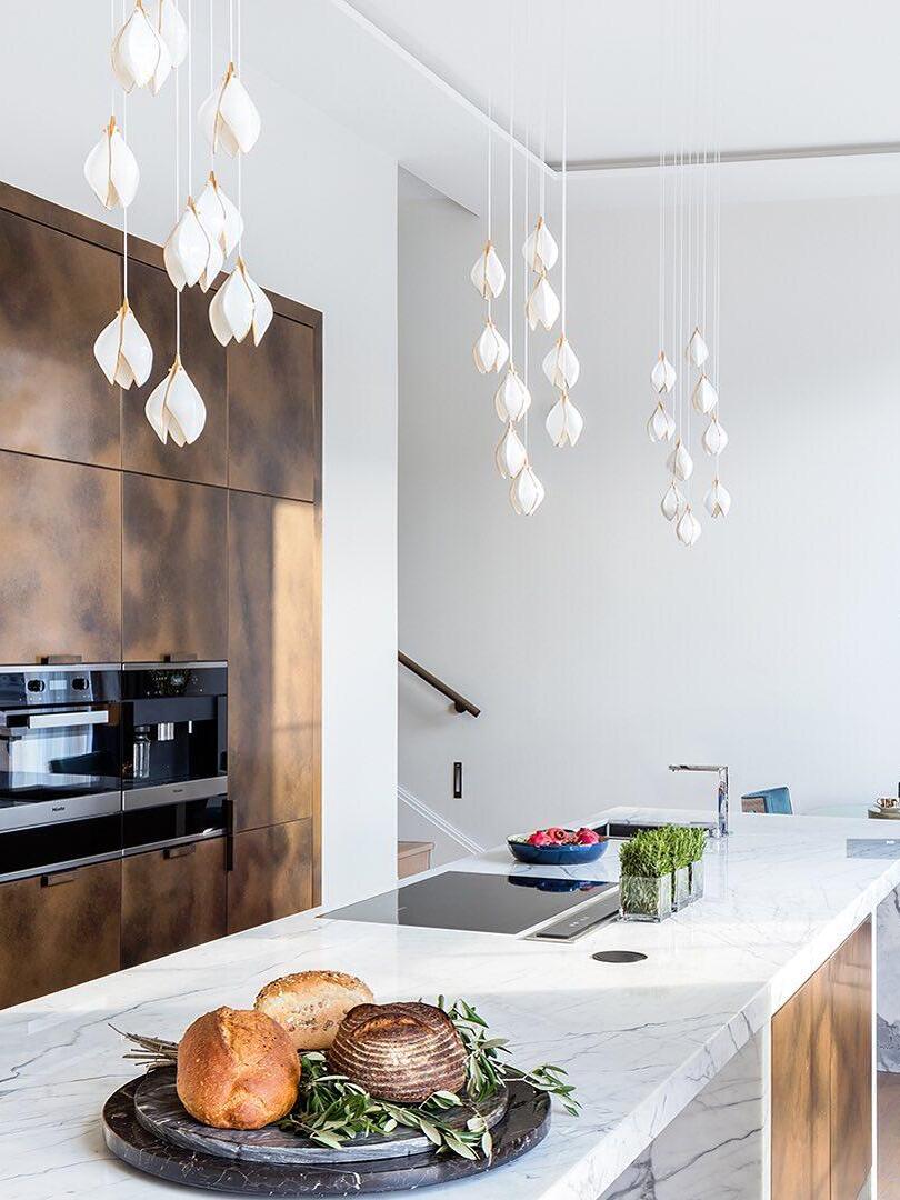 Small floral pendant groups above a counter