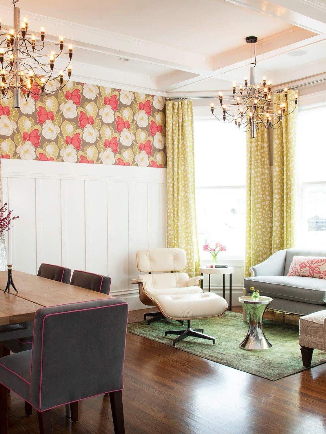 Two exposed-bulb chandeliers in a dining and living area