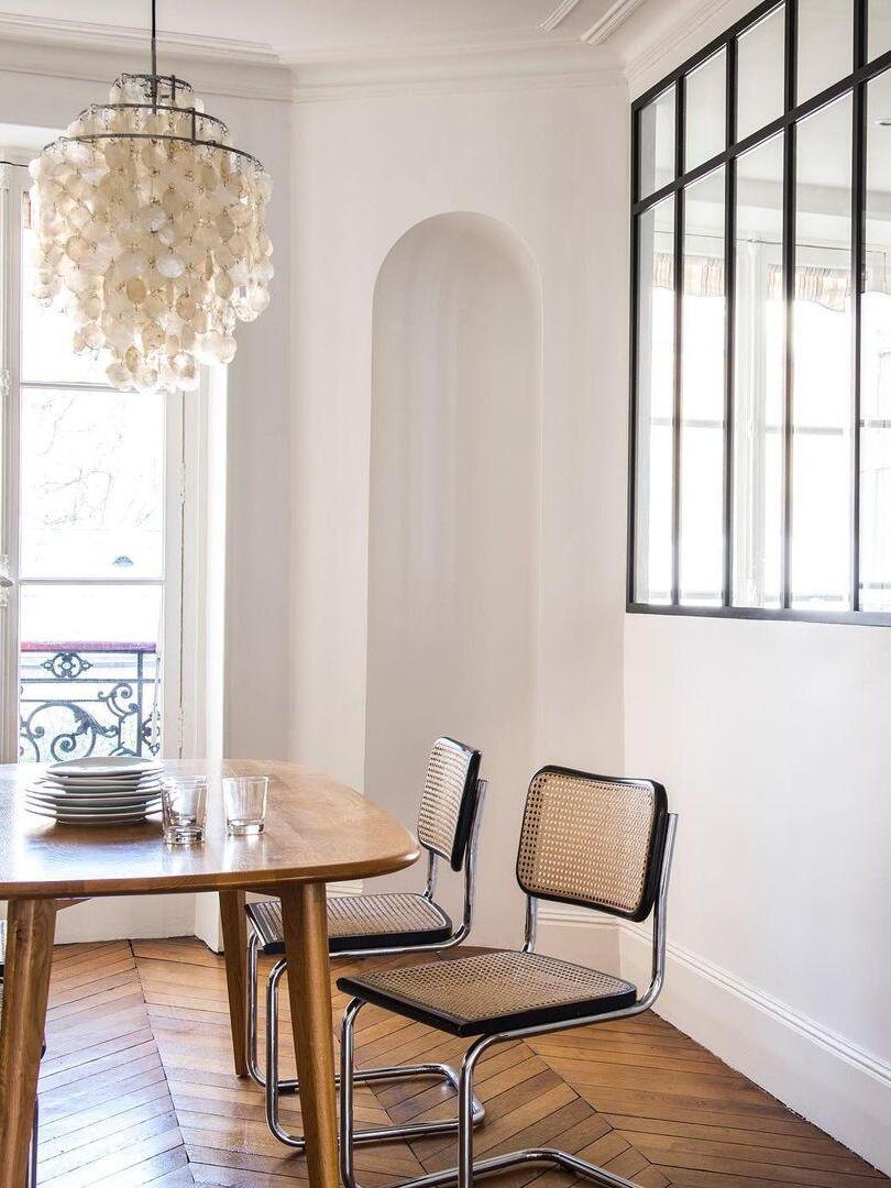 Tall shell pendant beside a large window
