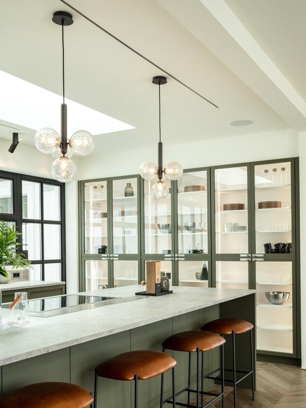 Glass cluster pendants over a kitchen island