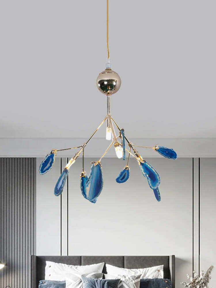 Blue stone-slice chandelier above a bedroom