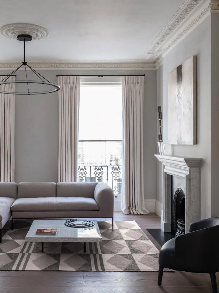 Dark ring pendant in sofa room with fireplace