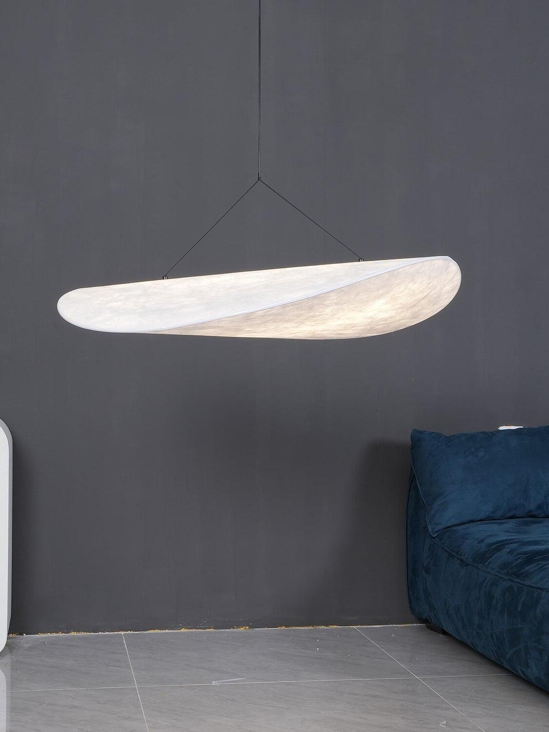 Cloud-like pendant against a dark wall