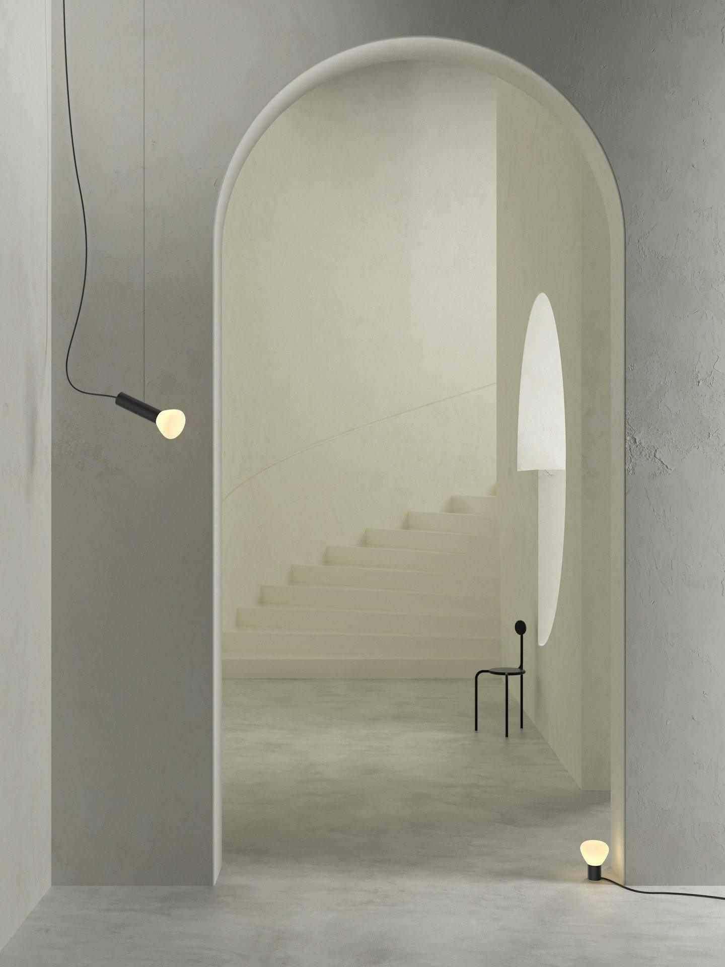 Small pendant lights near an arched interior doorway