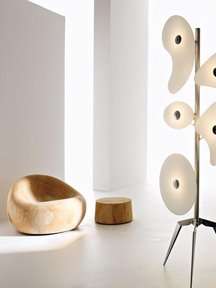 White panel floor lamp near sculptural seating