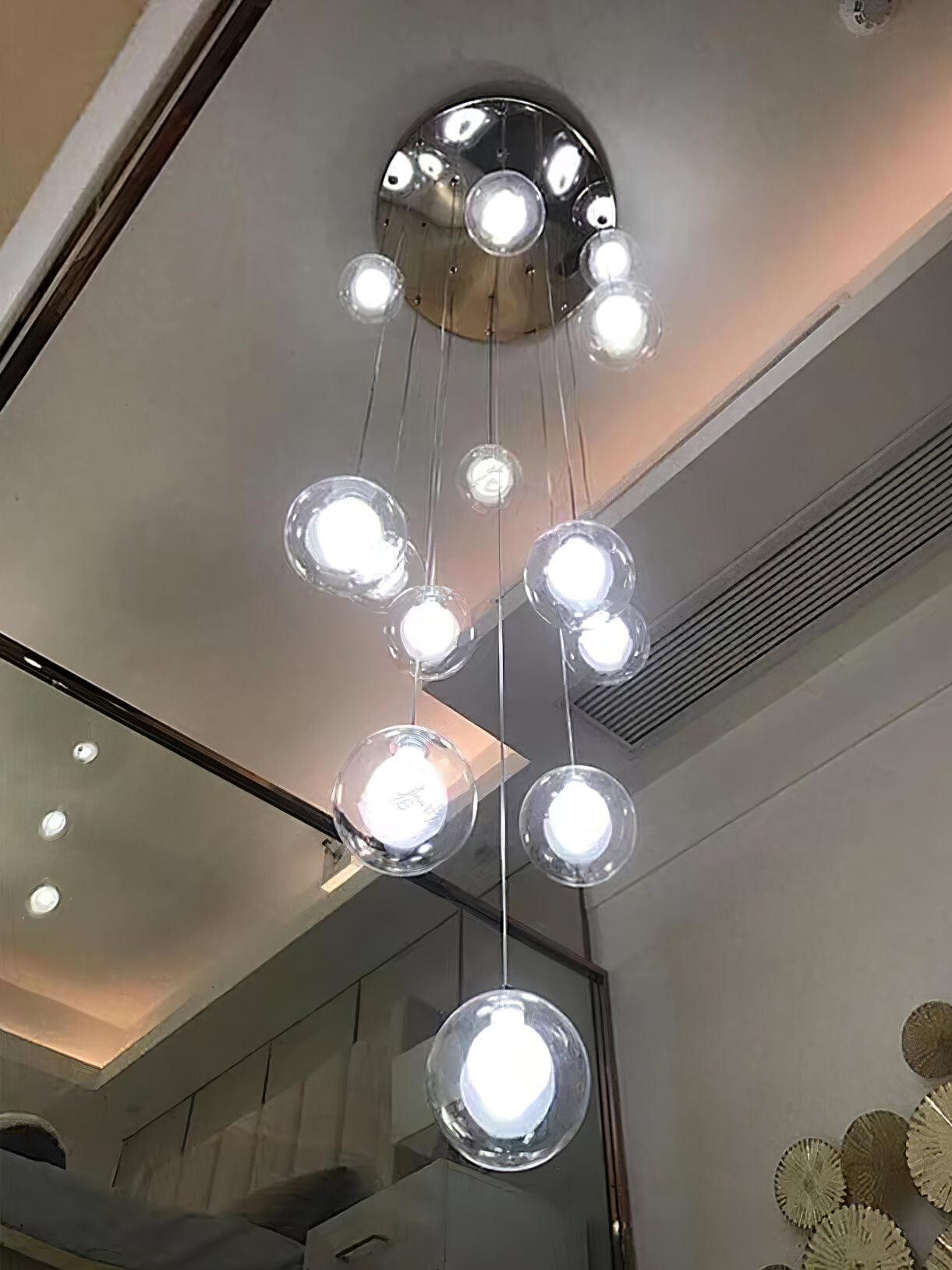 Glass globes photographed upward beside ceiling opening