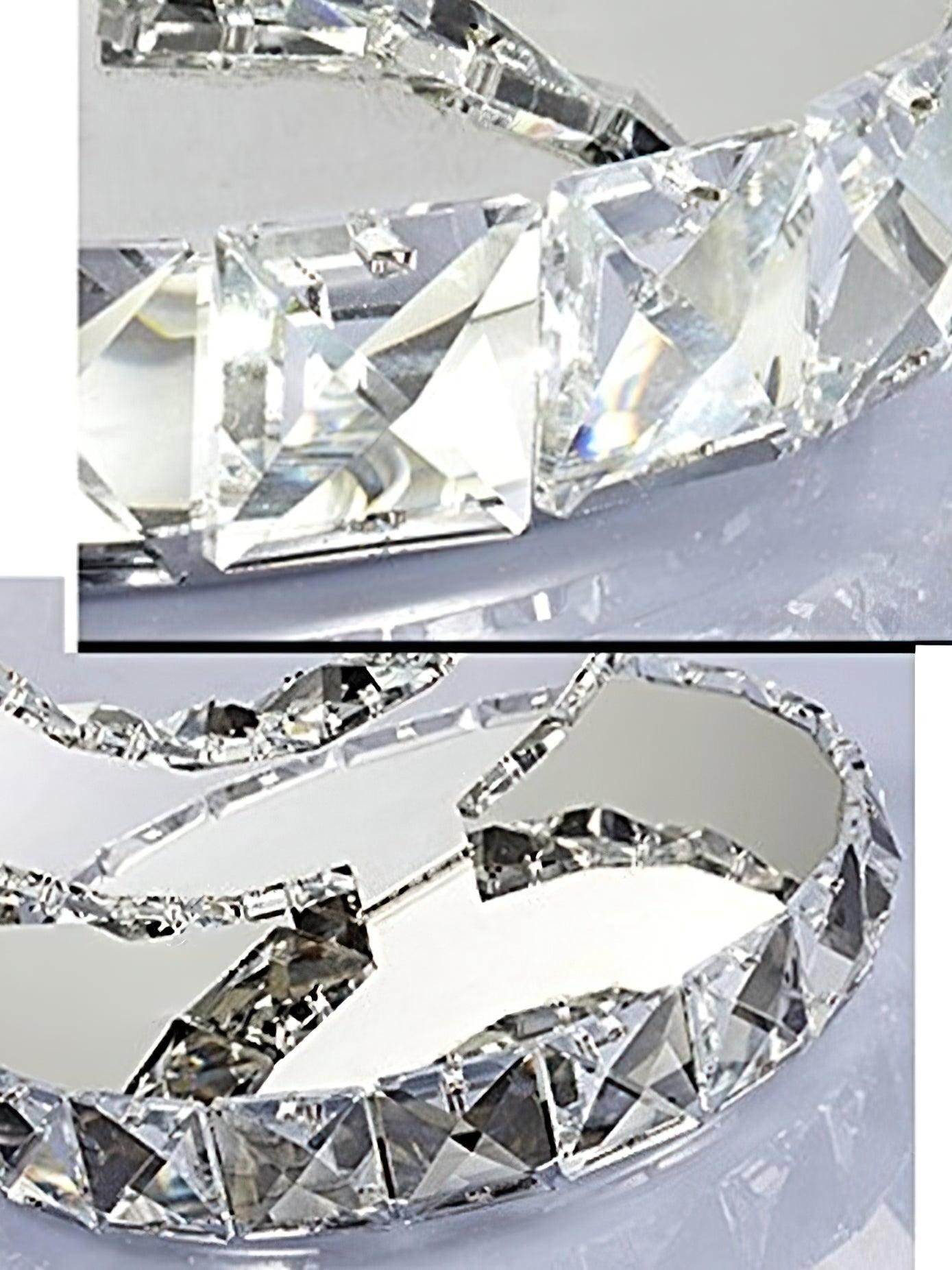 Two close-up views of faceted blocks along the round base and reflective ring edges