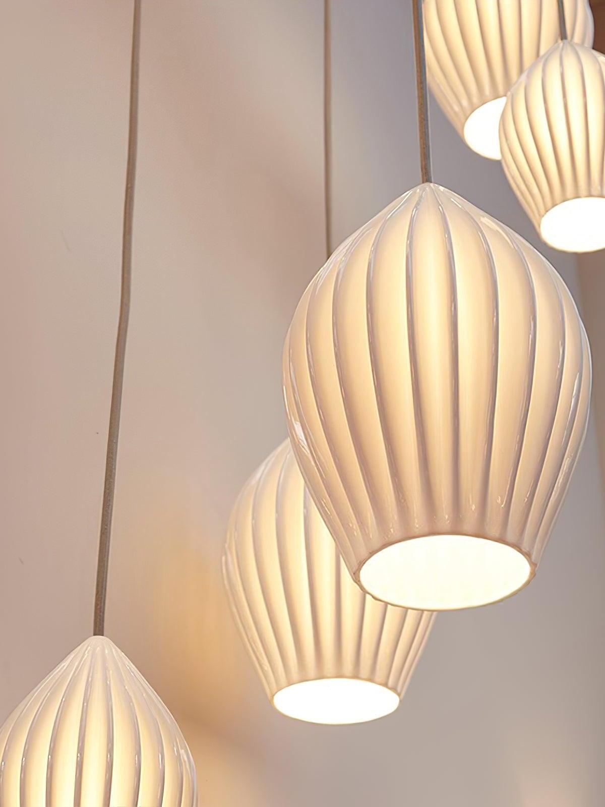 Upward view of illuminated ribbed shades with circular open bottoms
