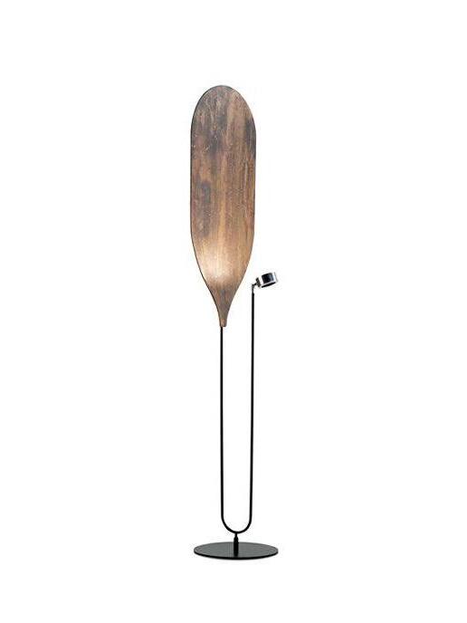 Bronze-brown elongated panel on black stand with small side light head