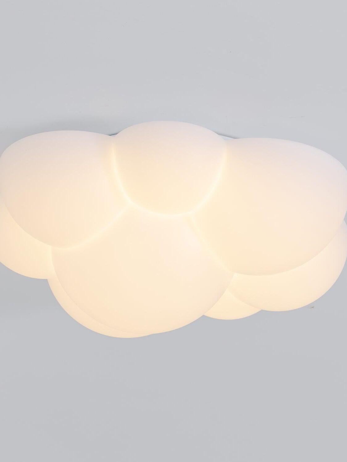 Side view of an illuminated Nuage cloud shape against a grey background