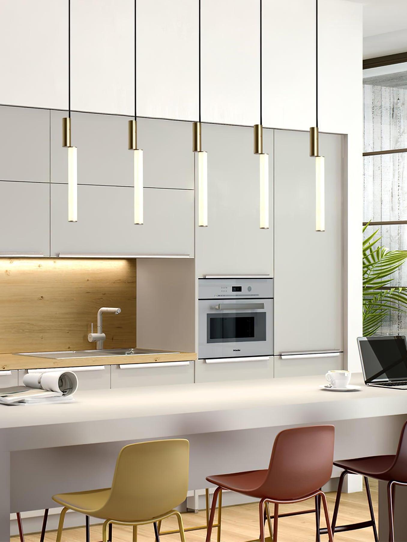 Five gold-top glowing rods above kitchen seating