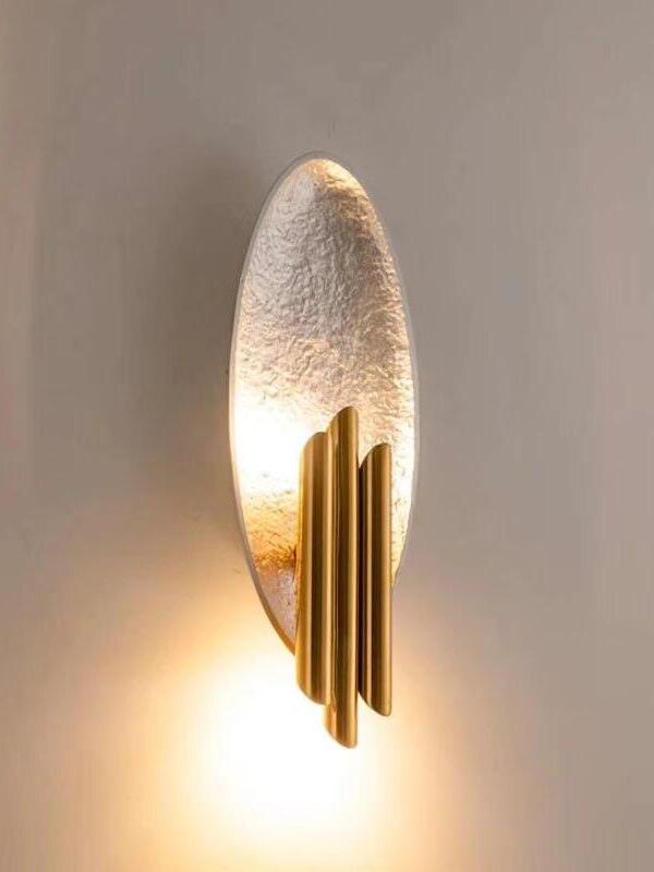 Lit silver-tone oval wall panel with gold-tone tube cluster