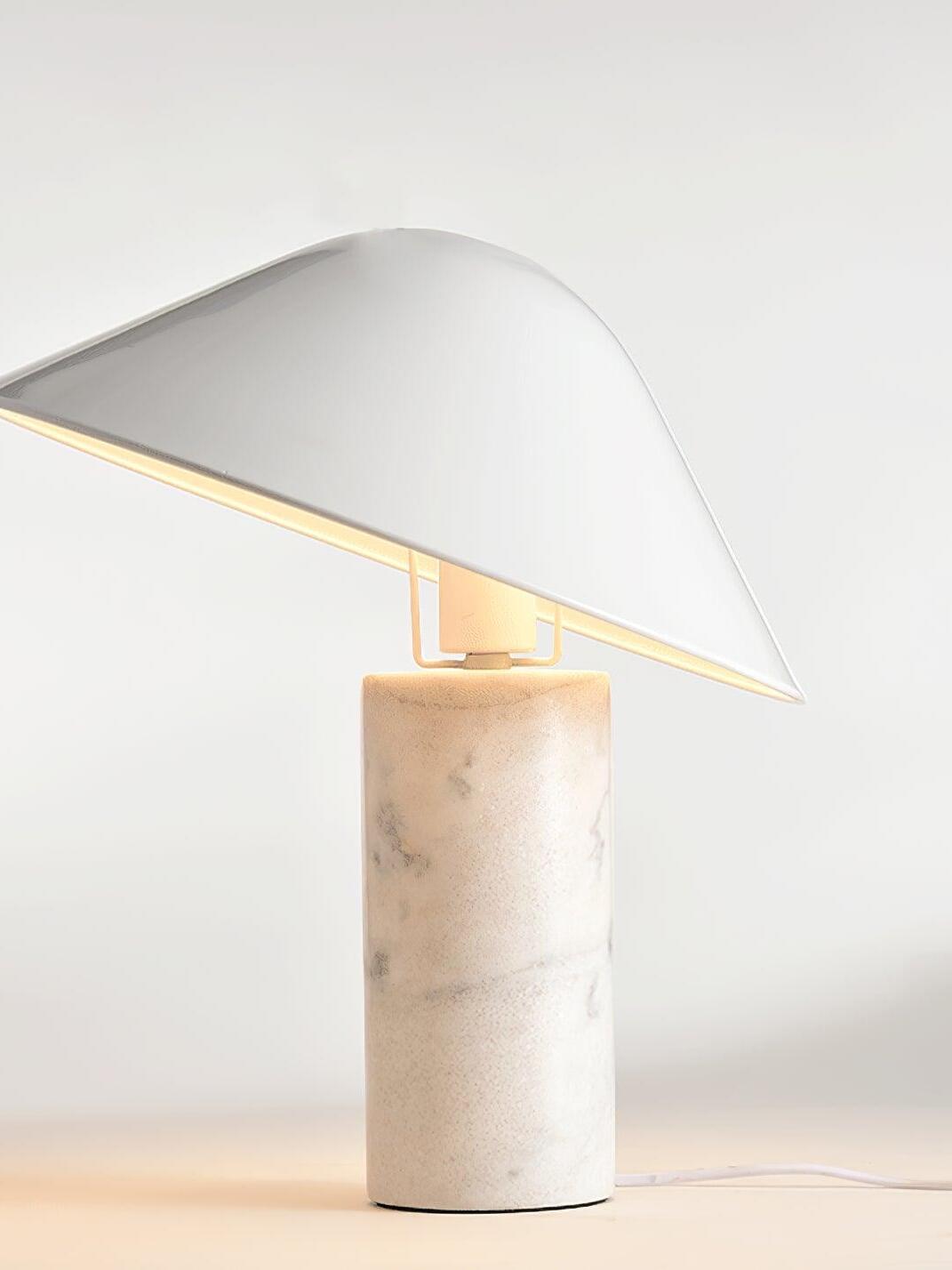 Side view of white cone-shade marble table lamp