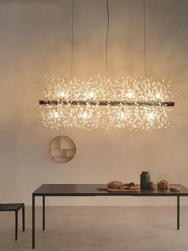 Glass-branch chandelier above a dark rectangular table