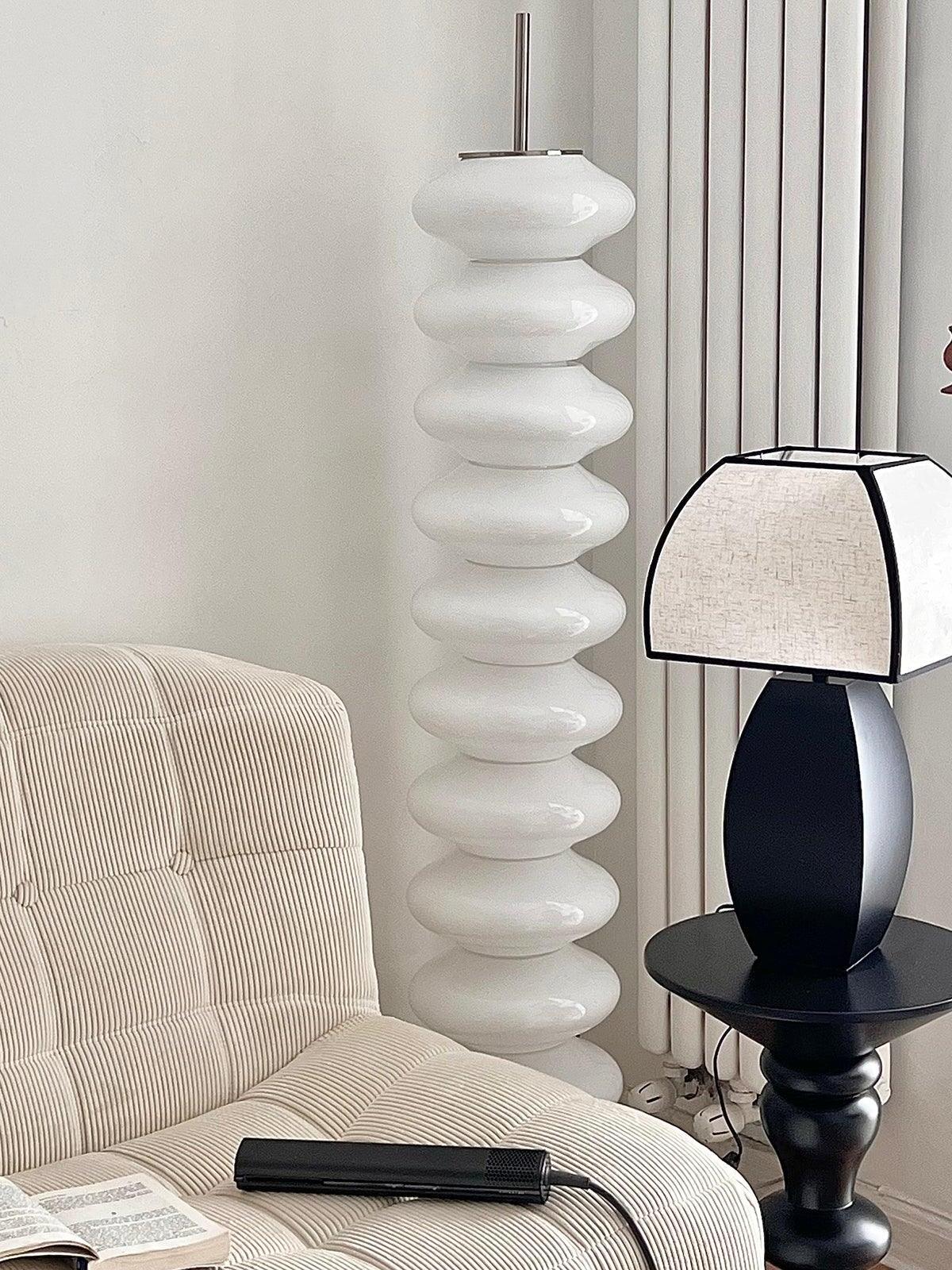 Javier lamp on small round table between chairs