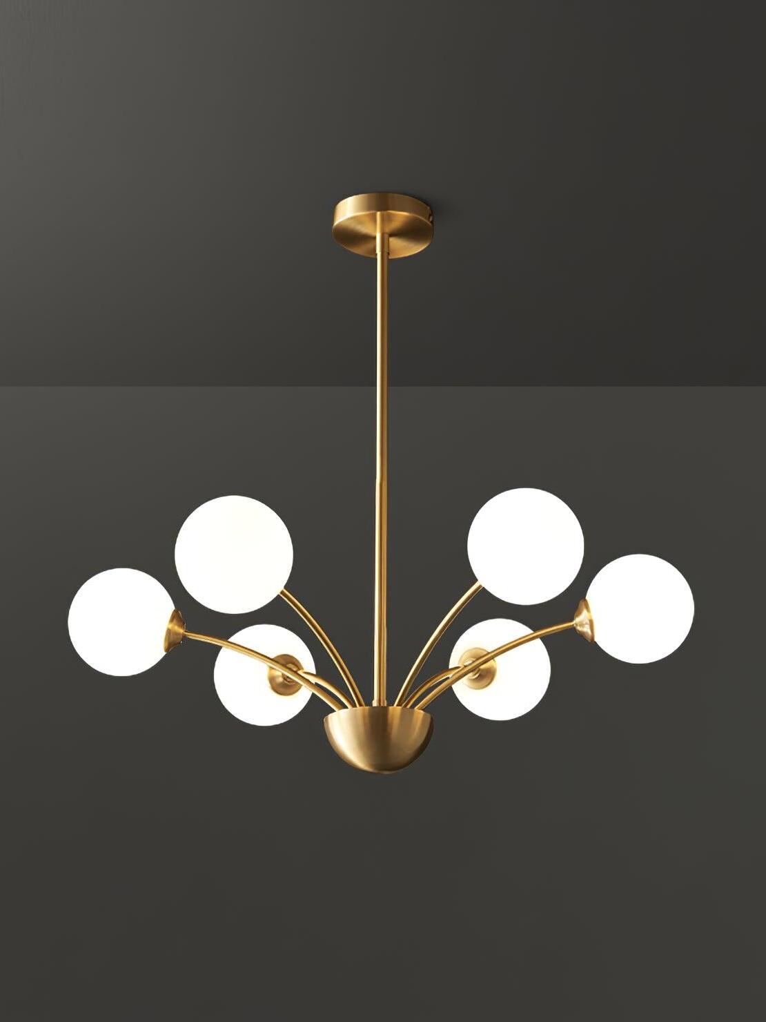 Six smooth white globes on curved brass-tone arms with a bowl-shaped hub, straight stem and round canopy