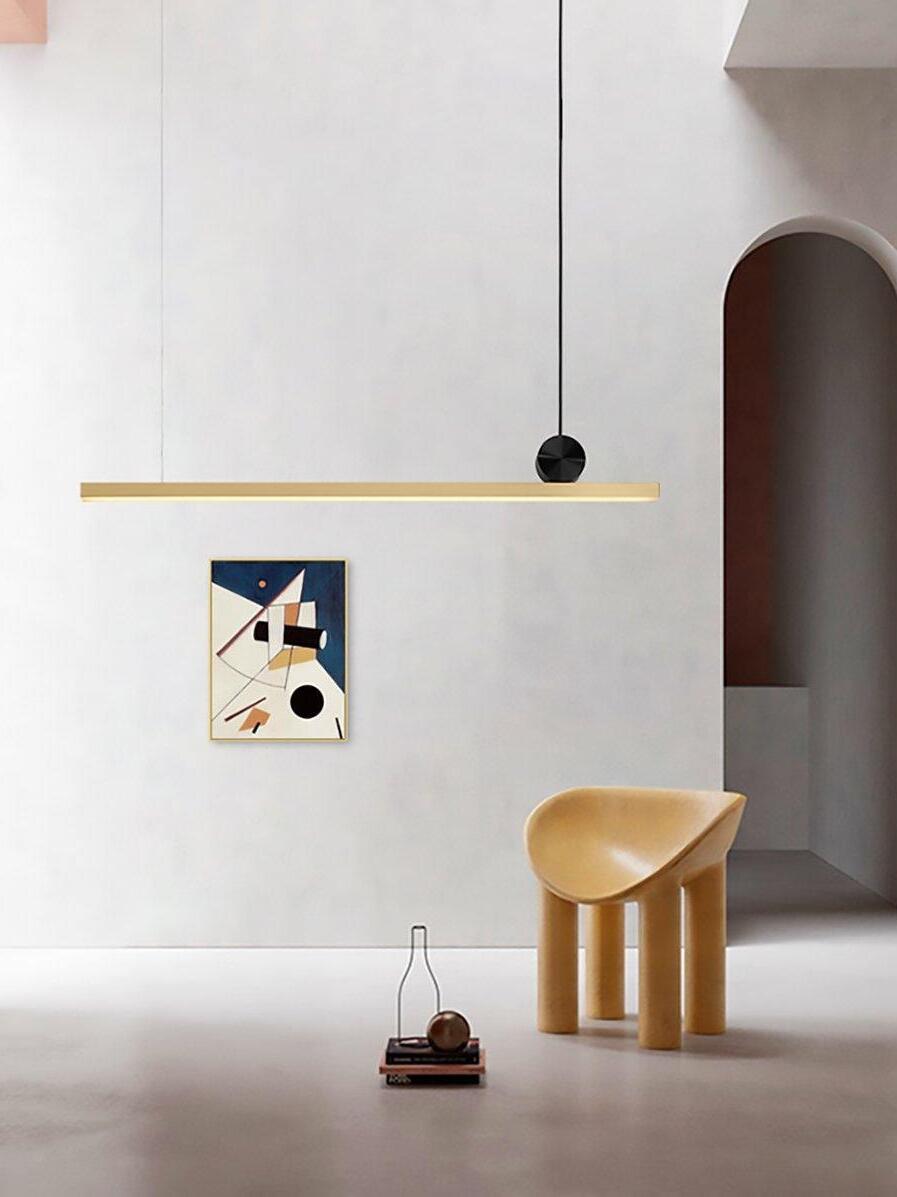 Cale bar pendant near a sculptural chair