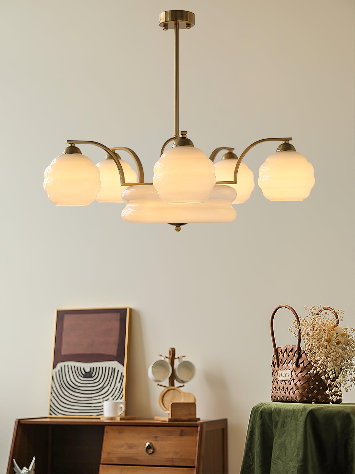 Glass chandelier above a wooden cabinet