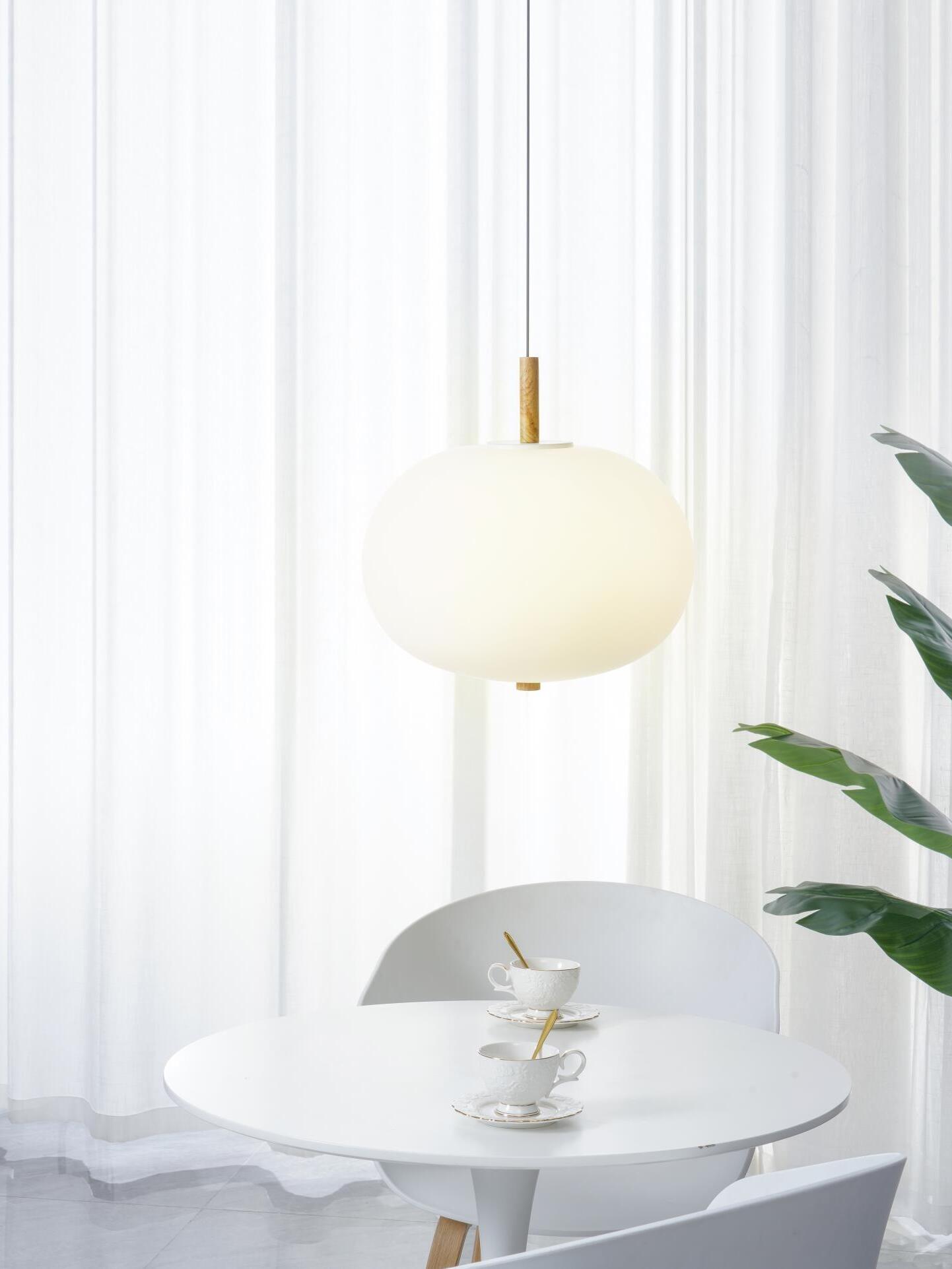 Single white globe above a small round table