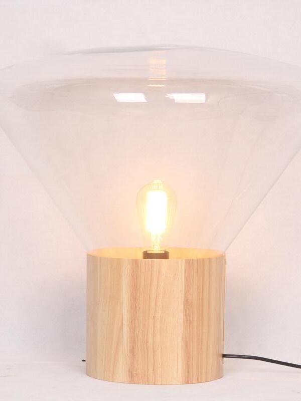 Large clear flared shade with lit filament-style bulb, wood base and black cord