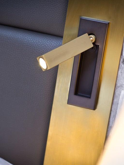 Copper-coloured reading head fitted into a bedside panel