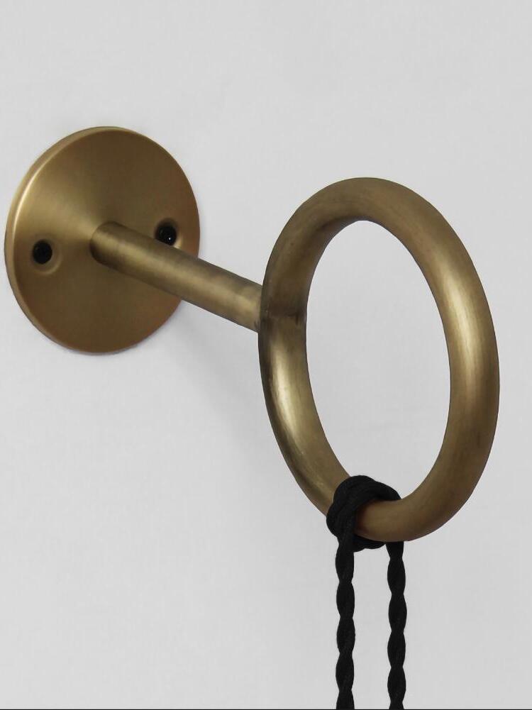 Round wall plate and ring bracket with knotted cord