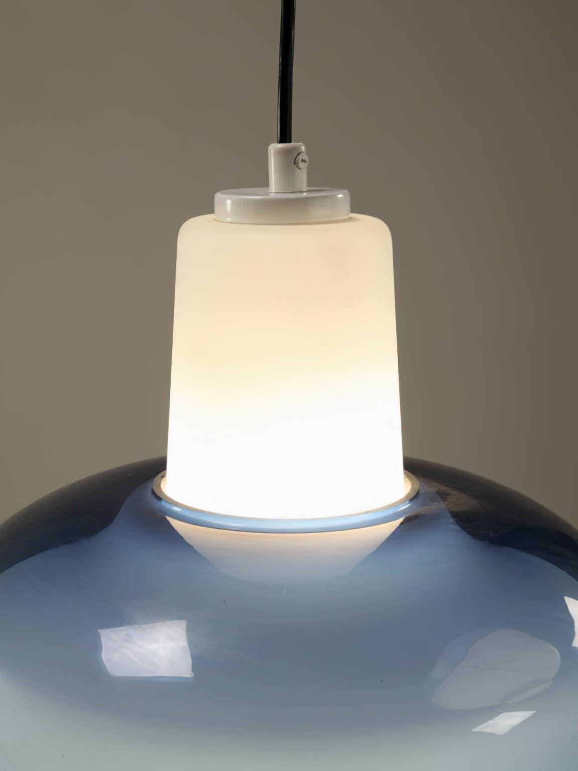 Close view of the Trendy pendant’s illuminated white upper neck and blue domed band.