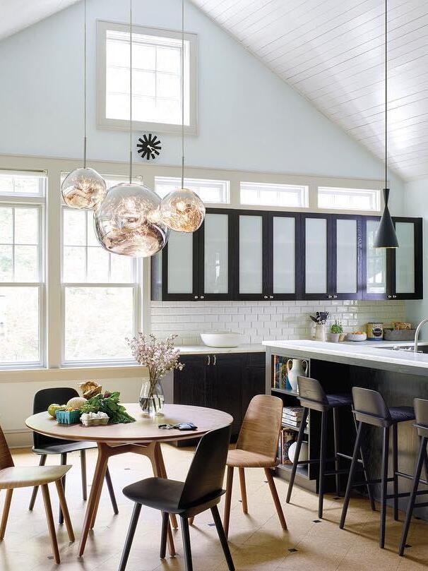 Group of reflective shades above a kitchen table