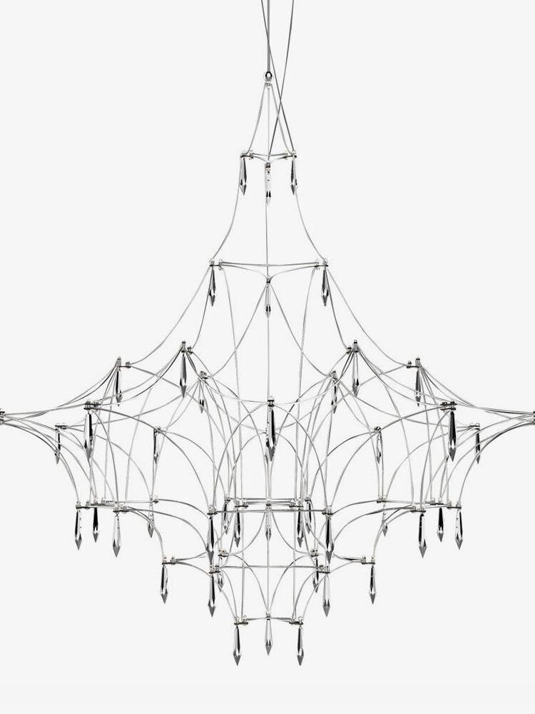 Silver lattice frame and crystal drops on white