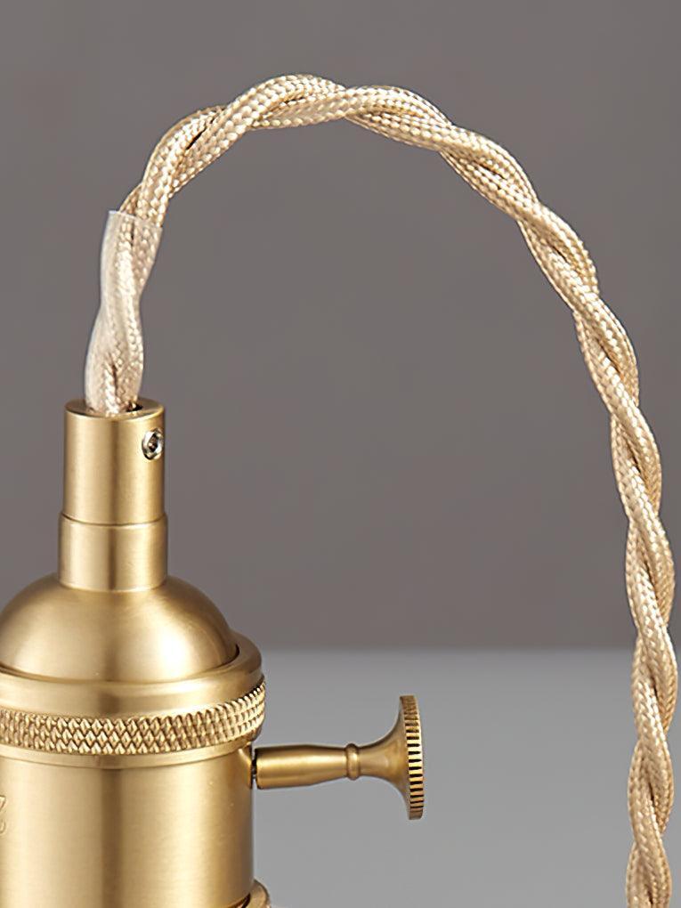 Close braided cord loop and brass-colour fitting