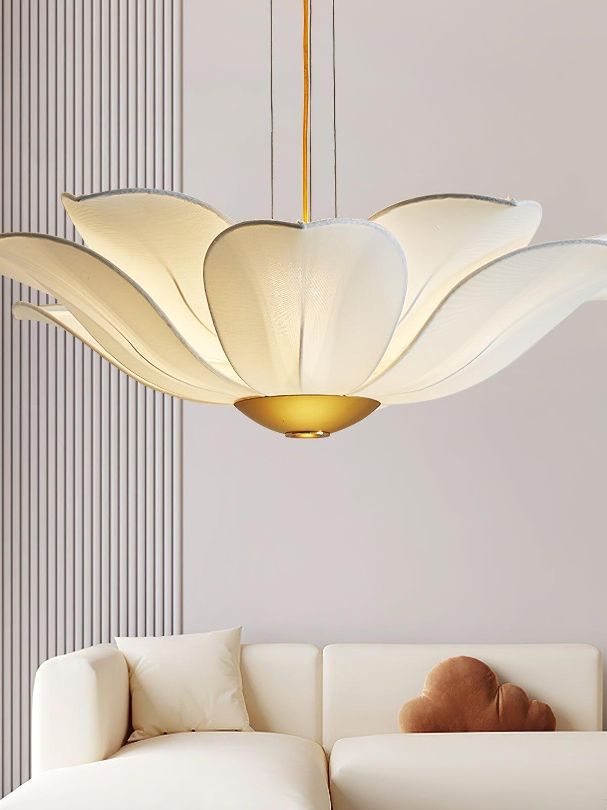 Layered white fabric petals over curved sofa