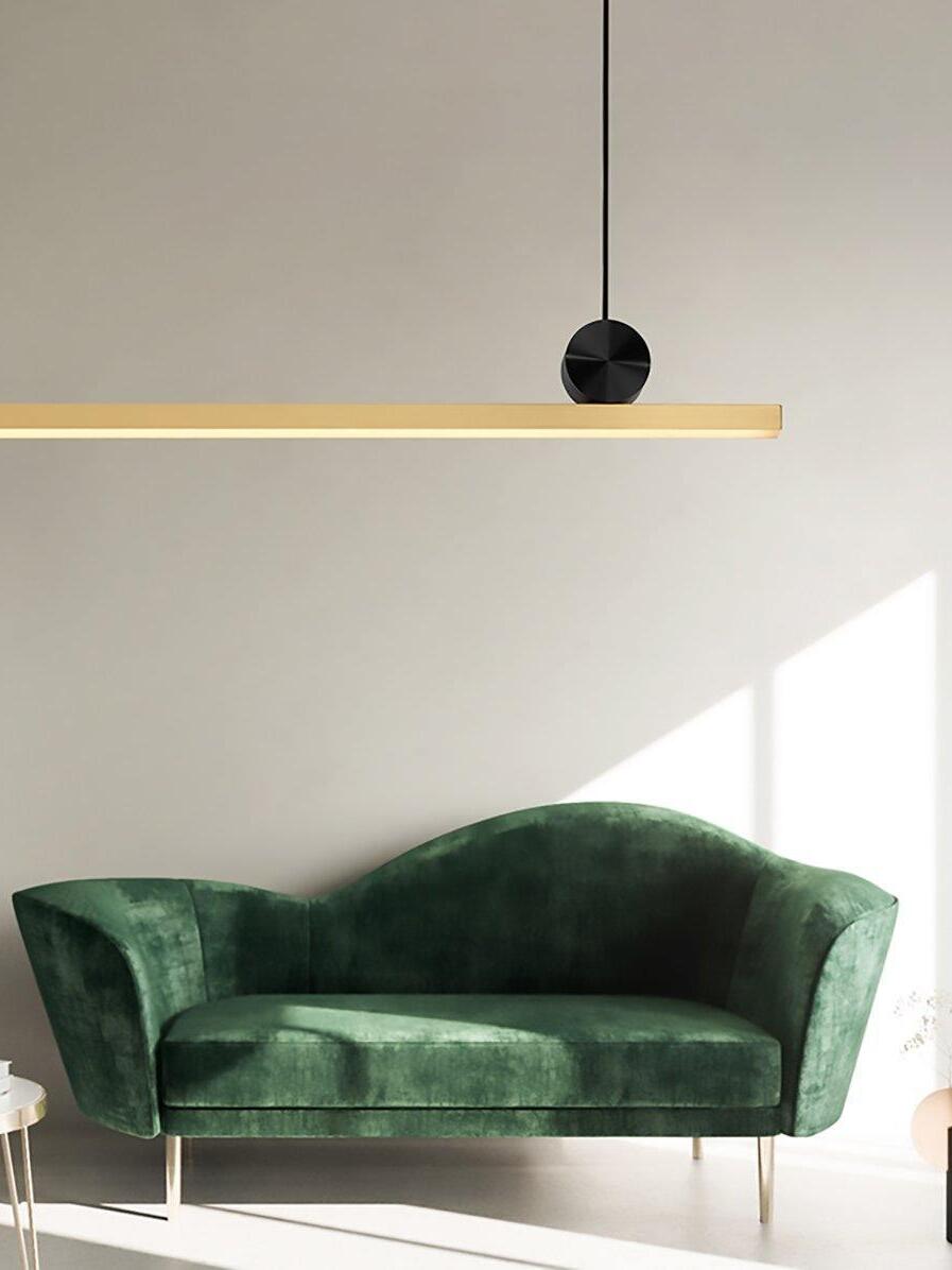 Cale pendant above a green sofa
