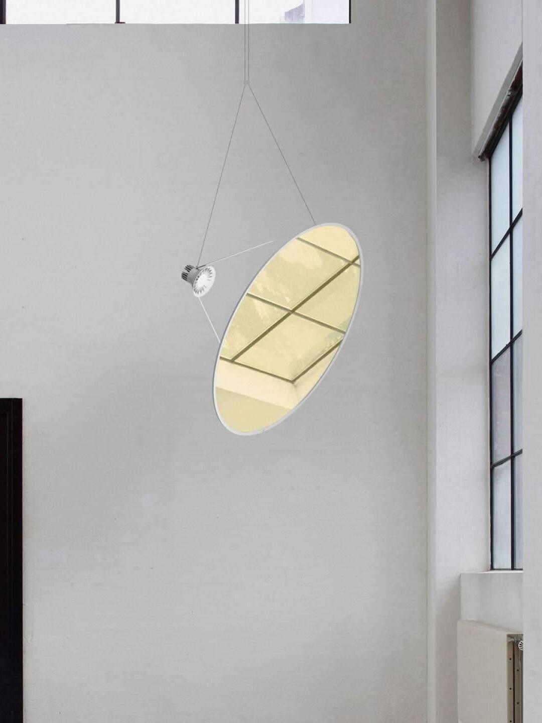 Gold-toned circular disc in a tall room