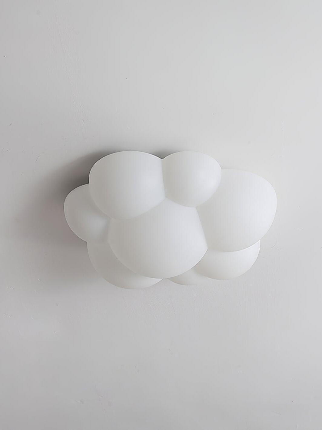 Unlit Nuage ceiling light with white rounded lobes against a pale ceiling