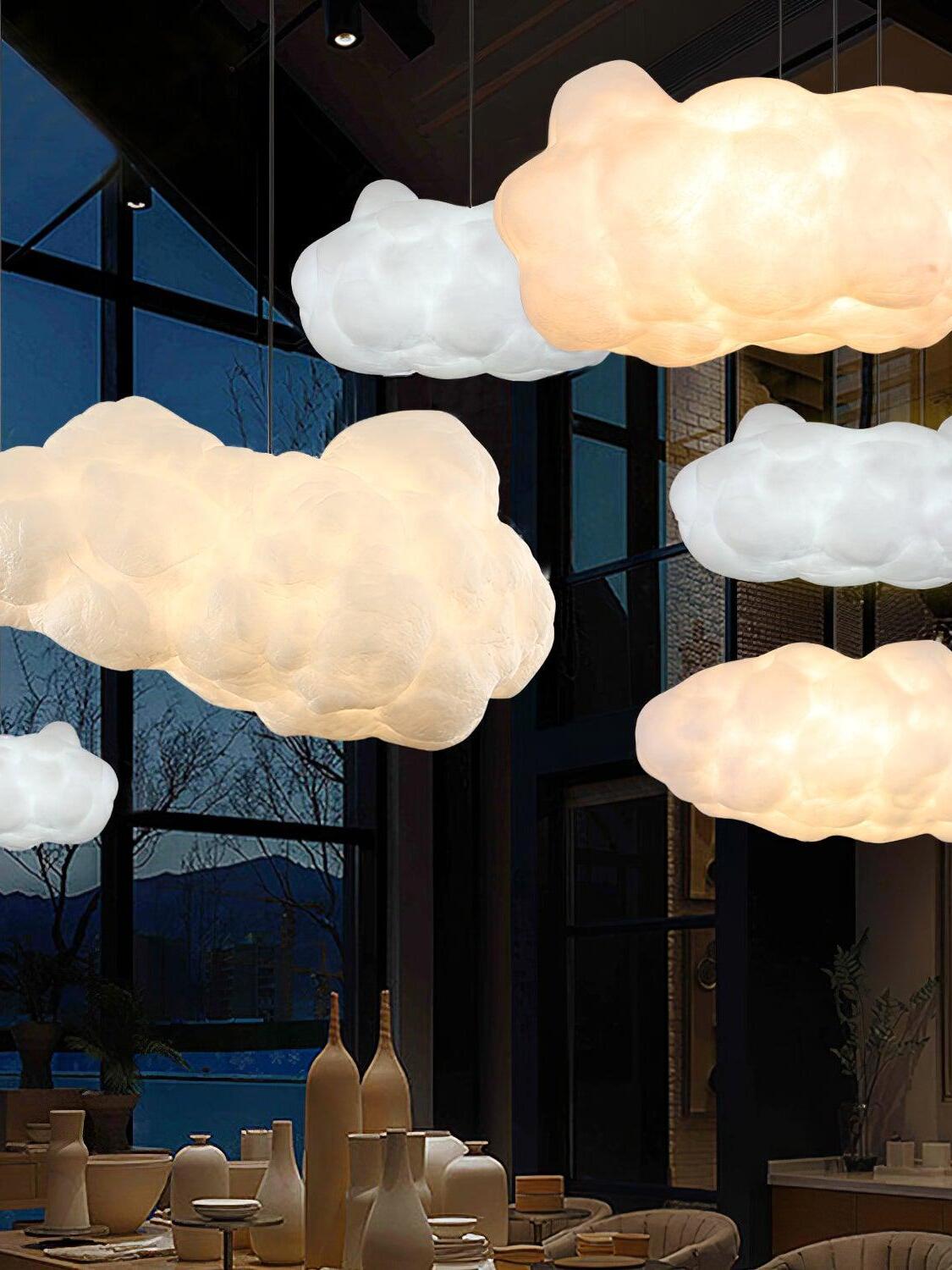 Warm-lit cloud pendants grouped at different heights