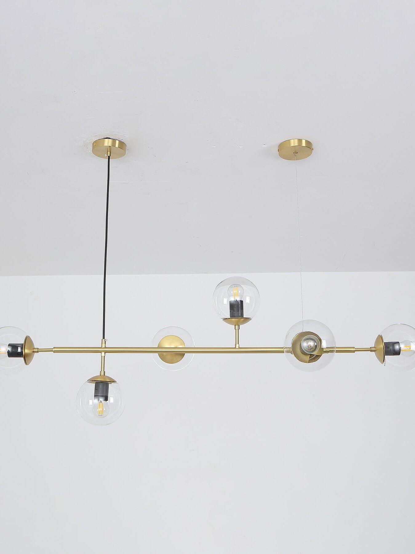 Clear globe chandelier viewed at ceiling level